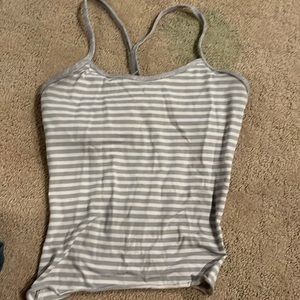 Movies are in striped tank top